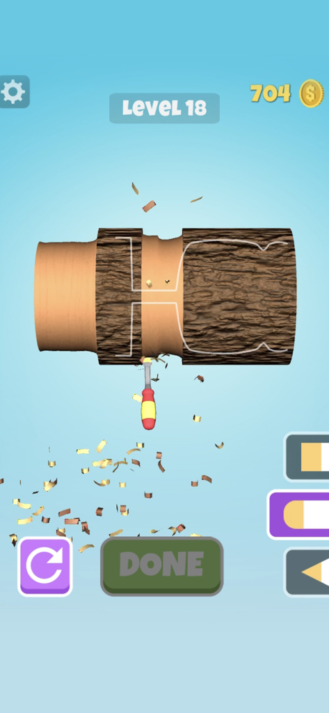 Wood Shop - Una captura de pantalla del juego Wood Shop que muestra un cincel tallando una pieza de madera giratoria para que coincida con una forma objetivo