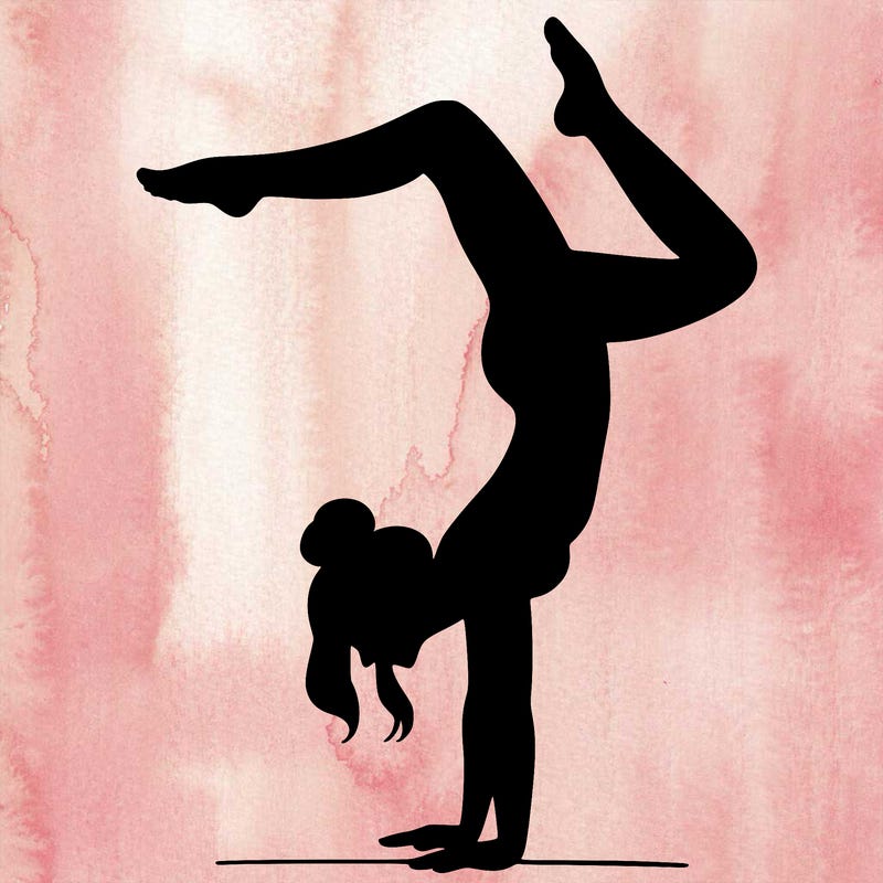 a woman doing a handstand