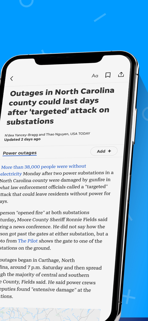 Pantalla de teléfono inteligente que muestra un artículo de noticias en la aplicación The Daily Advertiser.