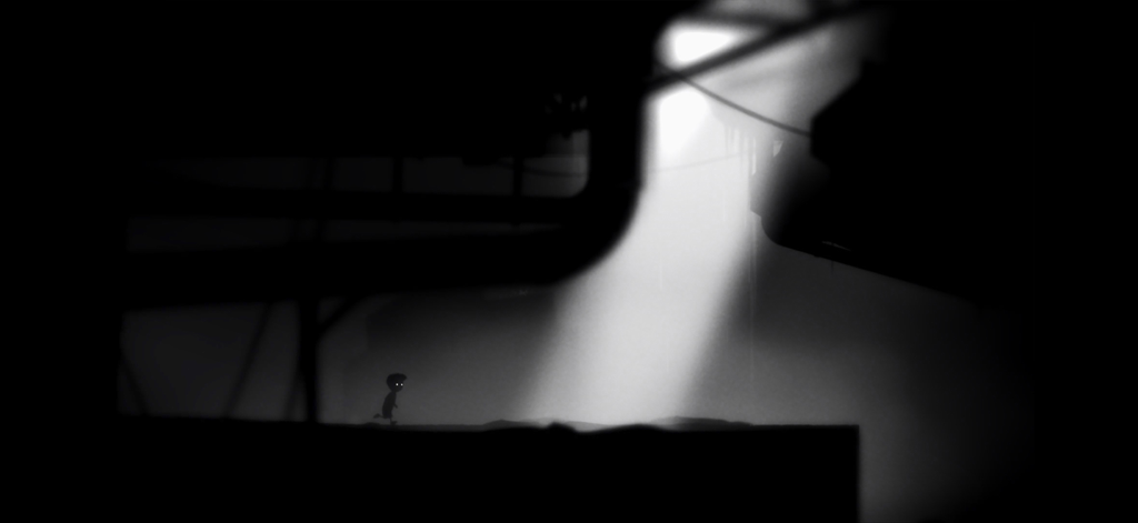 Playdead's LIMBO - Silueta de un niño en un entorno industrial oscuro bajo un rayo de luz en LIMBO