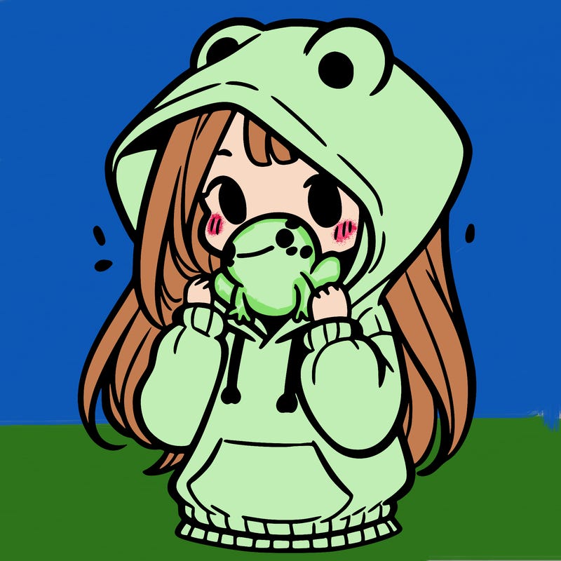 a girl holding a froggy hoodie