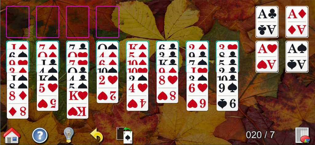 Gameplay of All-in-One Solitaire Pro featuring large playing cards on a background of autumn leaves.
