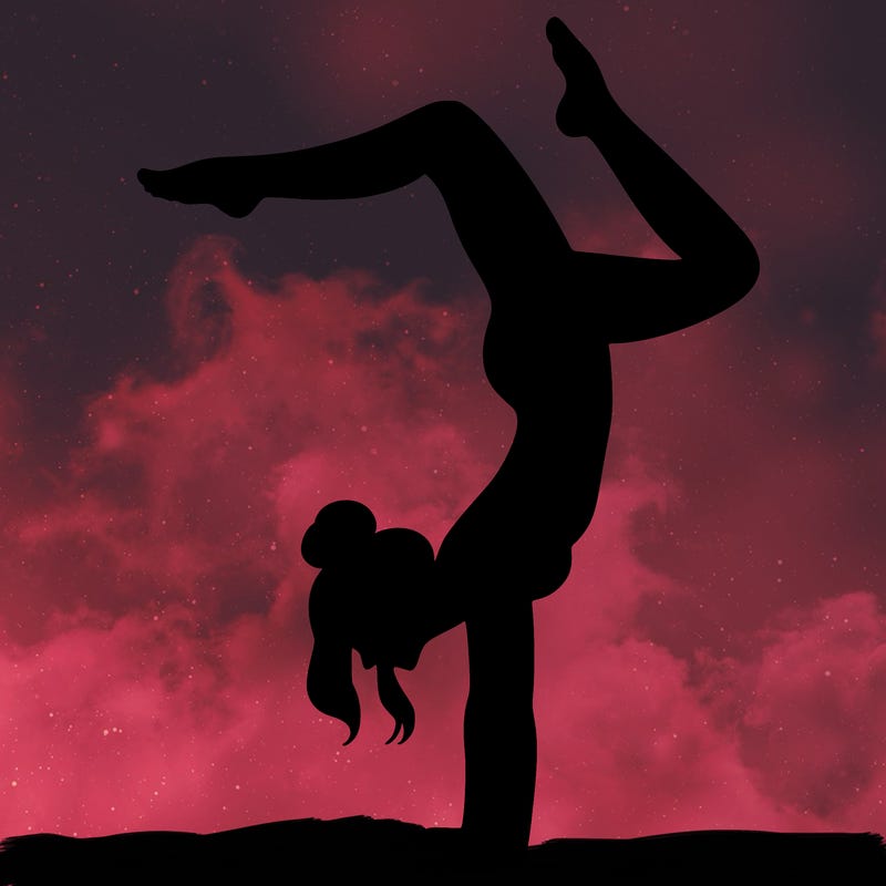 a woman doing a handstand