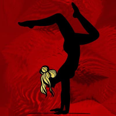 a woman doing a handstand