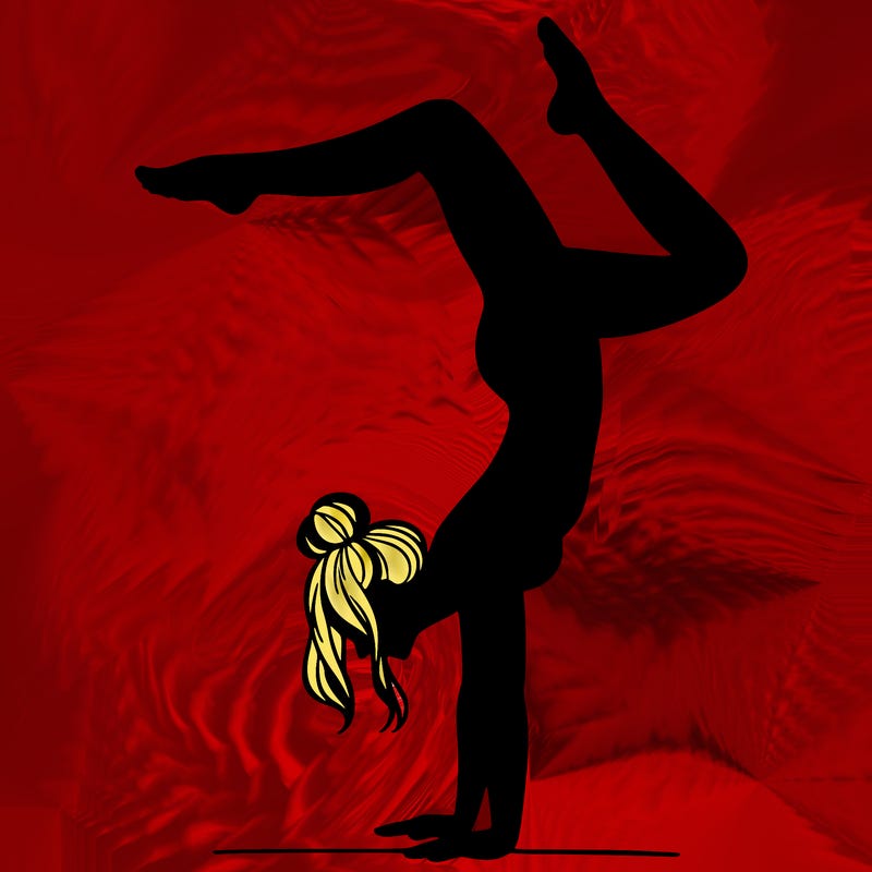 a woman doing a handstand