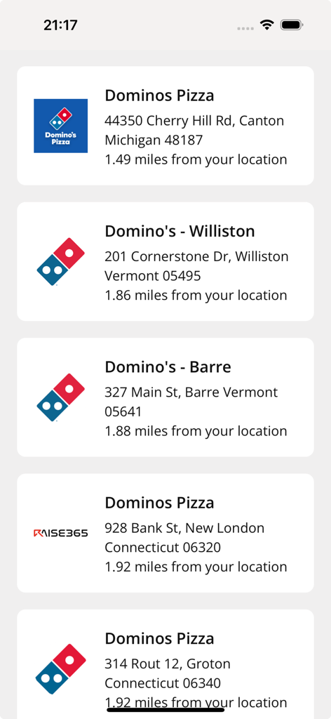 A list of nearby Domino's Pizza locations within the RAISE365 app showing addresses and distance from the user