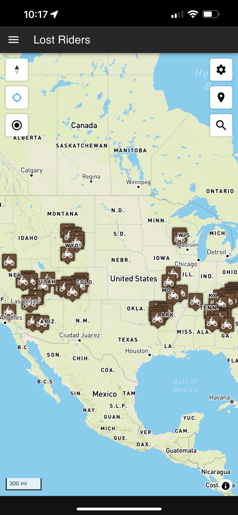 Lost Riders - Lost Riders app interface showing a map of North America with multiple ATV trail and mud park location markers