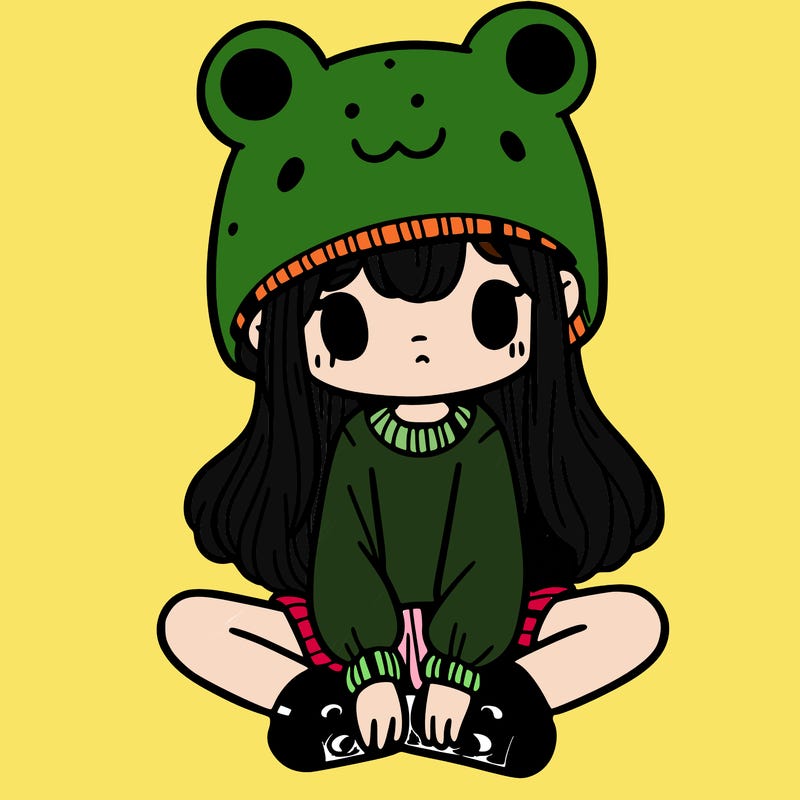 a girl wearing a frog hat and some frog socks