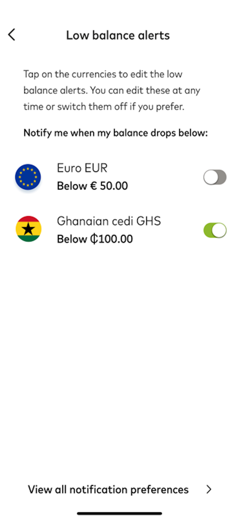MoneyWallet - Settings screen for low balance alerts in the MoneyWallet app featuring Euro and Ghanaian cedi currency options.