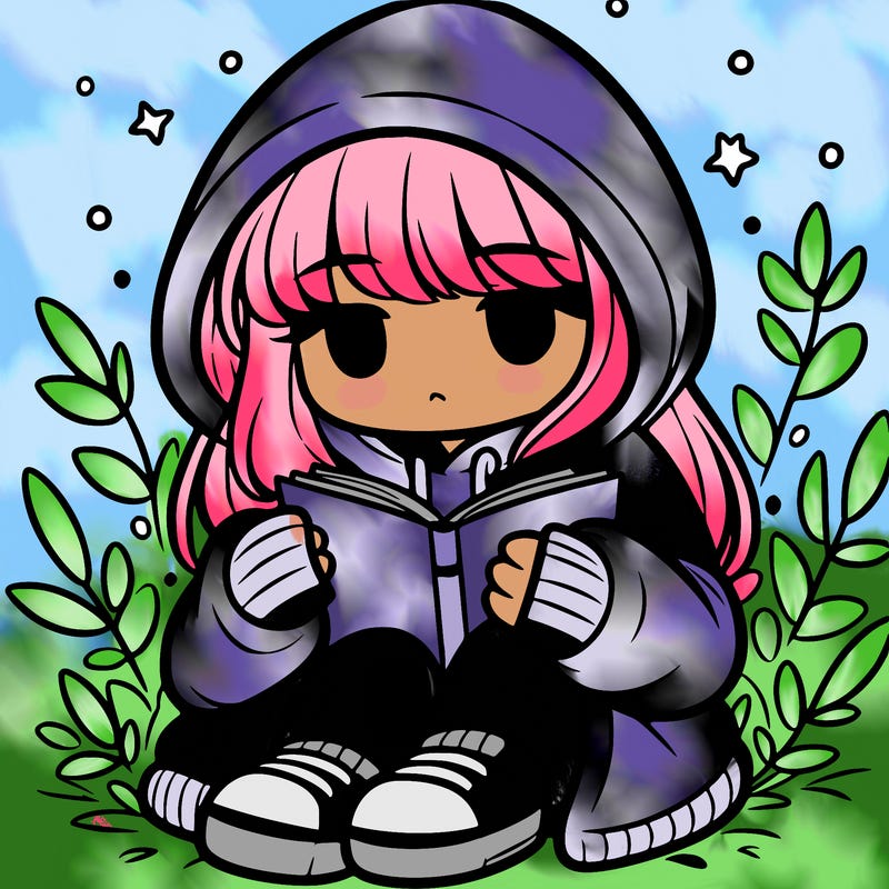 girl in oversized hoodie reading a book