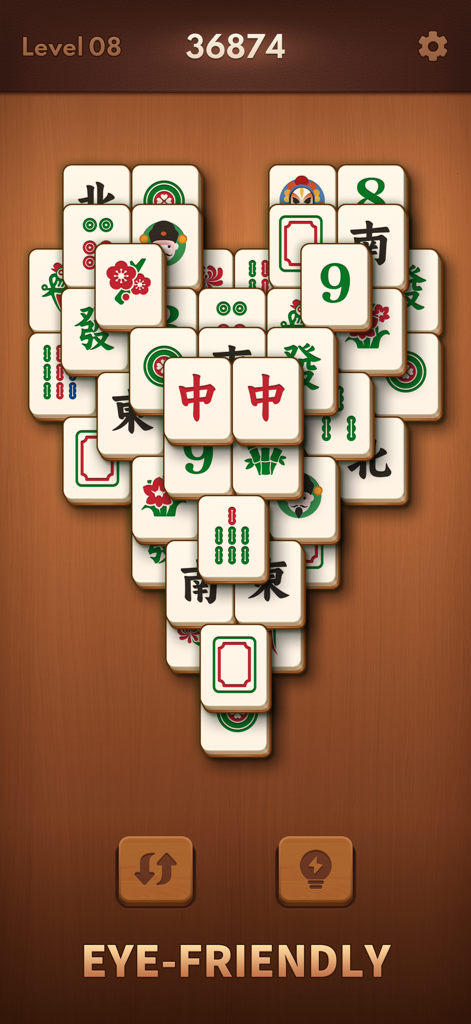 Mahjong Blast game screen showing large eye-friendly tiles arranged in a heart formation for seniors.
