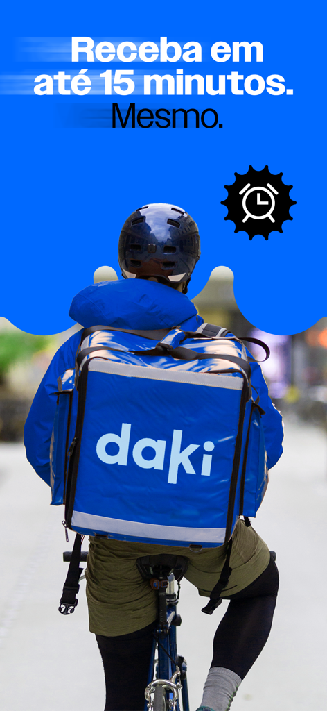 A Daki delivery courier on a bicycle with a blue branded thermal backpack for 15-minute grocery delivery