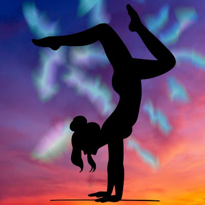 a woman doing a handstand