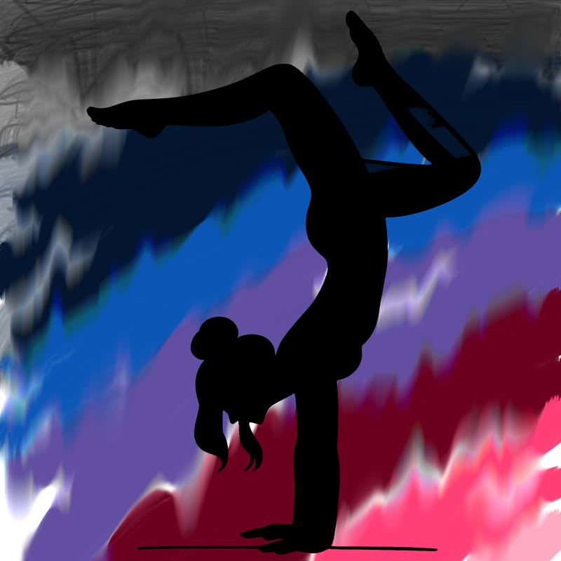 a woman doing a handstand