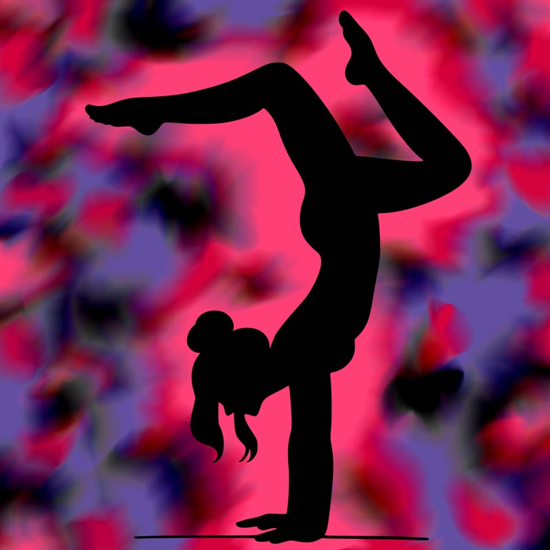 a woman doing a handstand