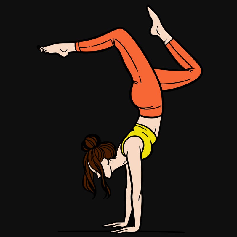 a woman doing a handstand