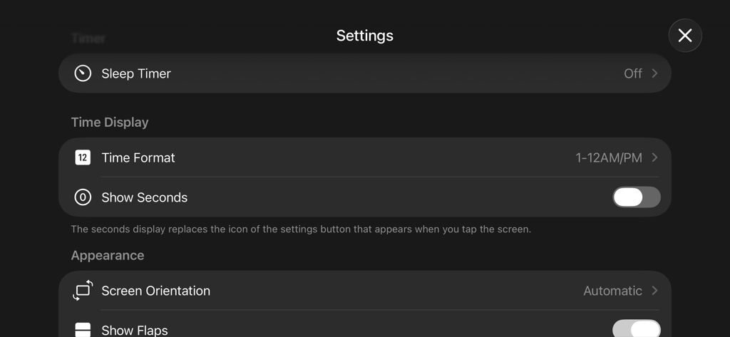 Fliqlo - The settings interface of the Fliqlo flip clock app featuring time and appearance customization options.