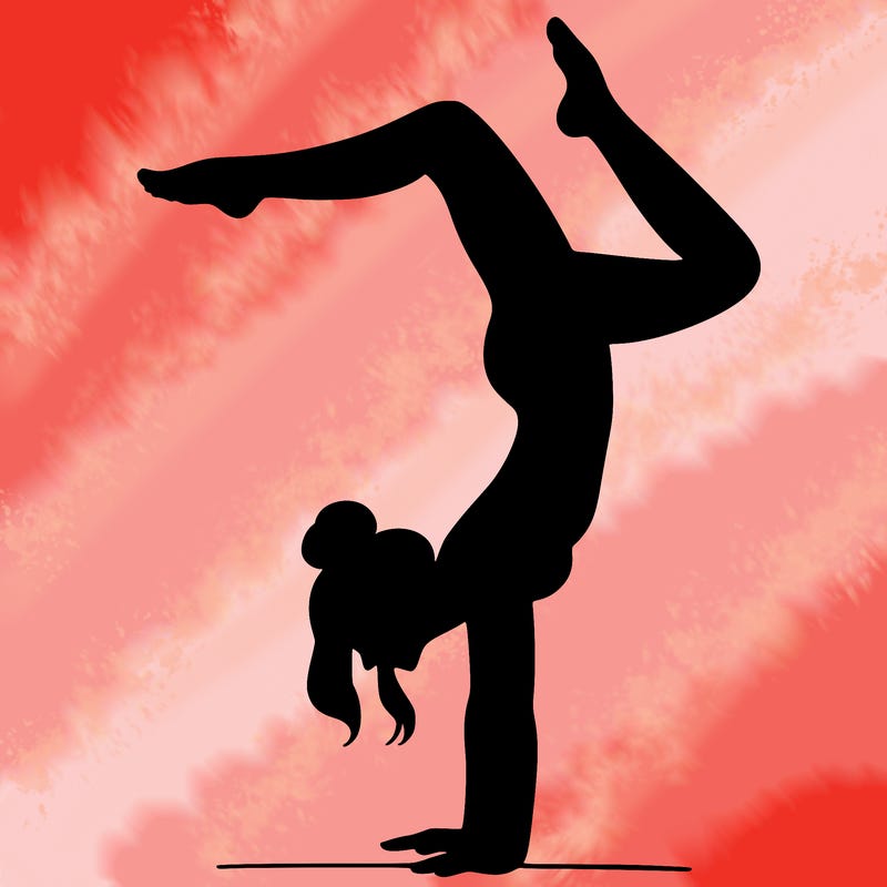 a woman doing a handstand