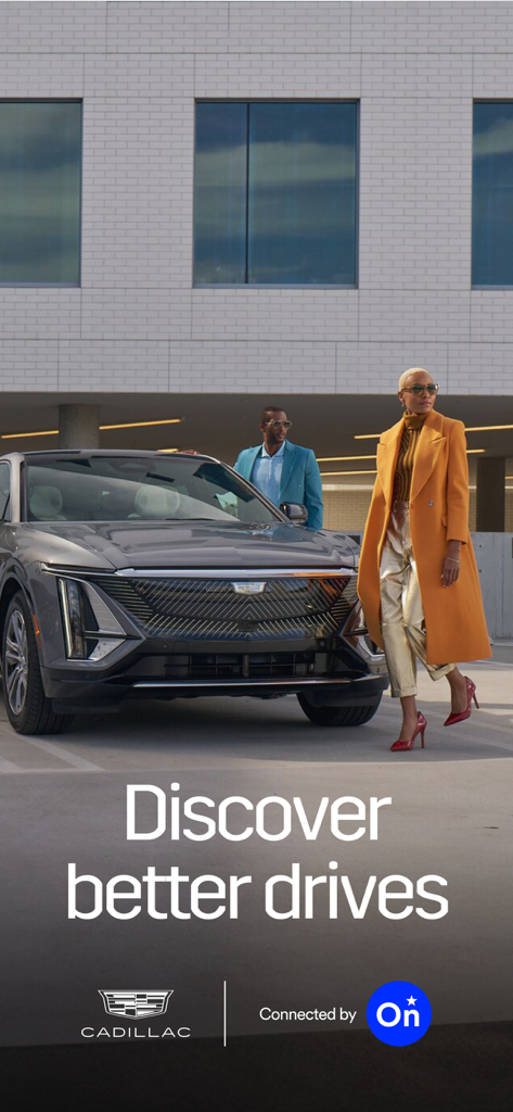 A man and a woman standing near a Cadillac vehicle with the text Discover better drives