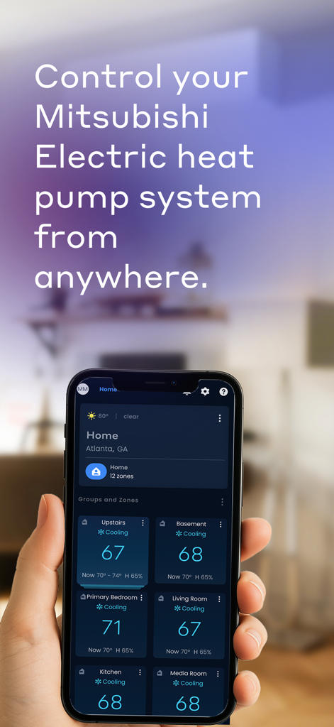 A hand holding a smartphone displaying the Comfort by Mitsubishi Electric app interface for multi zone home temperature control