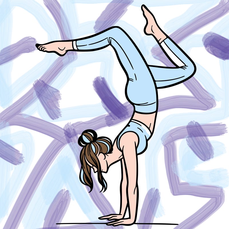 a woman doing a handstand