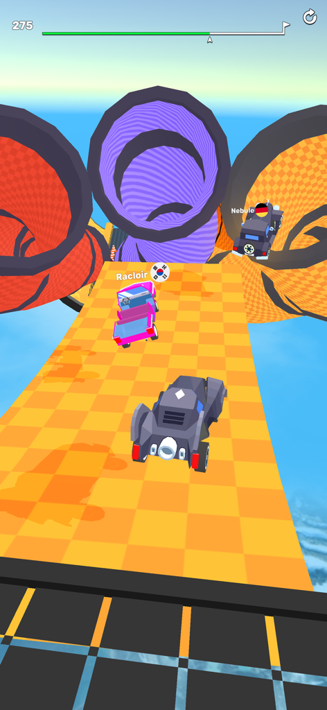 Ramp Racing 3D — Extreme Race - Cars racing on an orange checkered ramp towards large colorful loop tunnels in a 3D environment