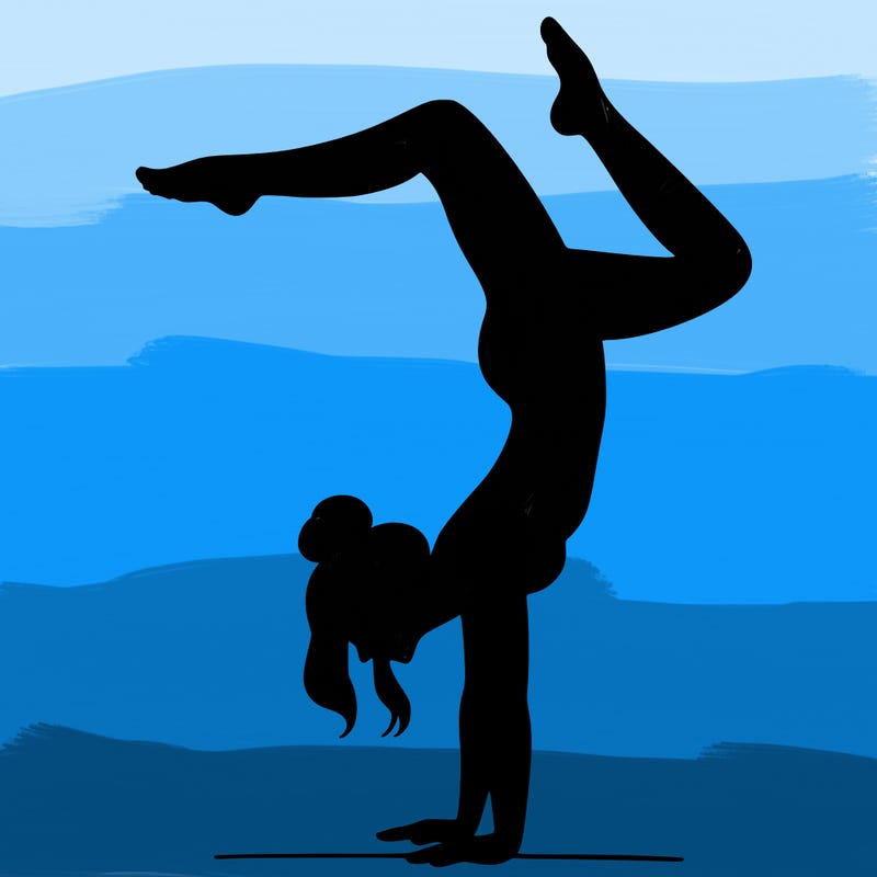 a woman doing a handstand