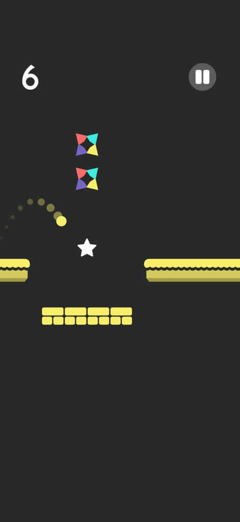 Gameplay screenshot of Color Switch featuring a yellow ball jumping through colored star obstacles on a dark background