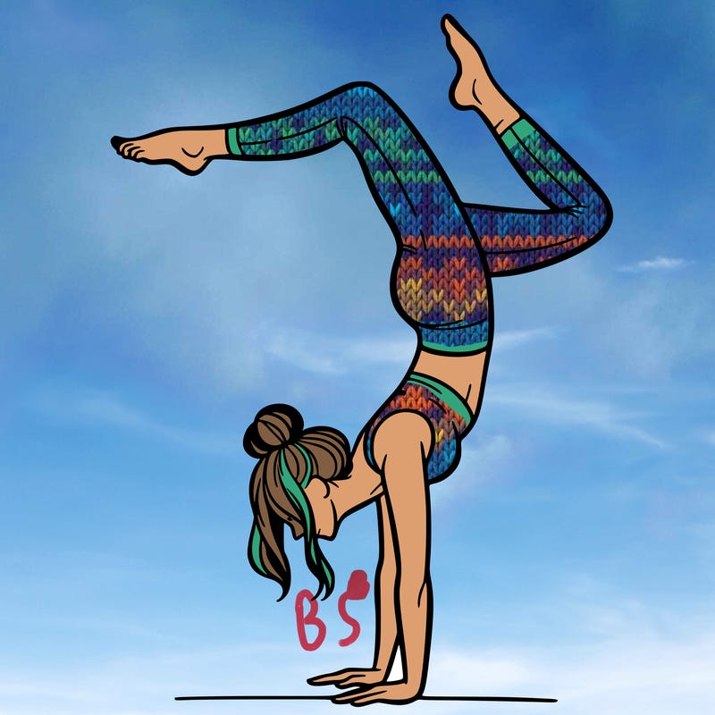 a woman doing a handstand