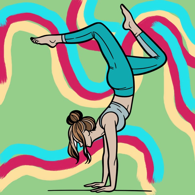 a woman doing a handstand