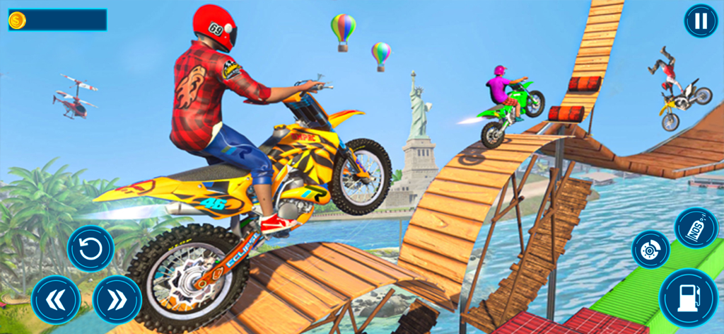 A rider performing a wheelie on a yellow dirt bike over a wooden stunt ramp with the Statue of Liberty in the background.