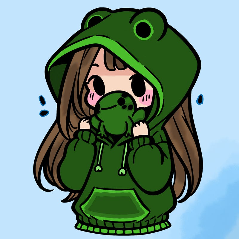 a girl holding a froggy hoodie