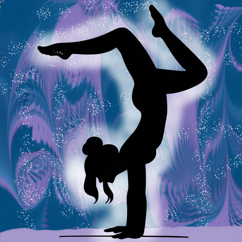 a woman doing a handstand