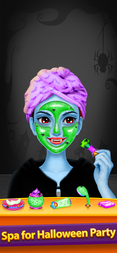 Halloween Makeover Salon Games - A character with blue skin wearing a green facial mask and a purple bat-themed head towel in a Halloween spa game.
