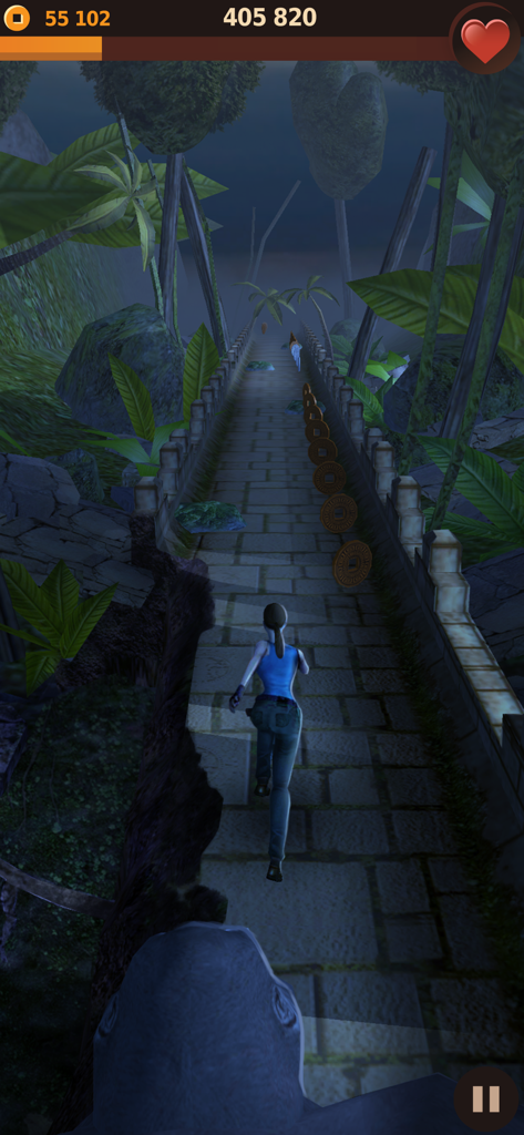 Gameplay of Tomb Runner showing a character escaping a giant gorilla in a jungle temple environment