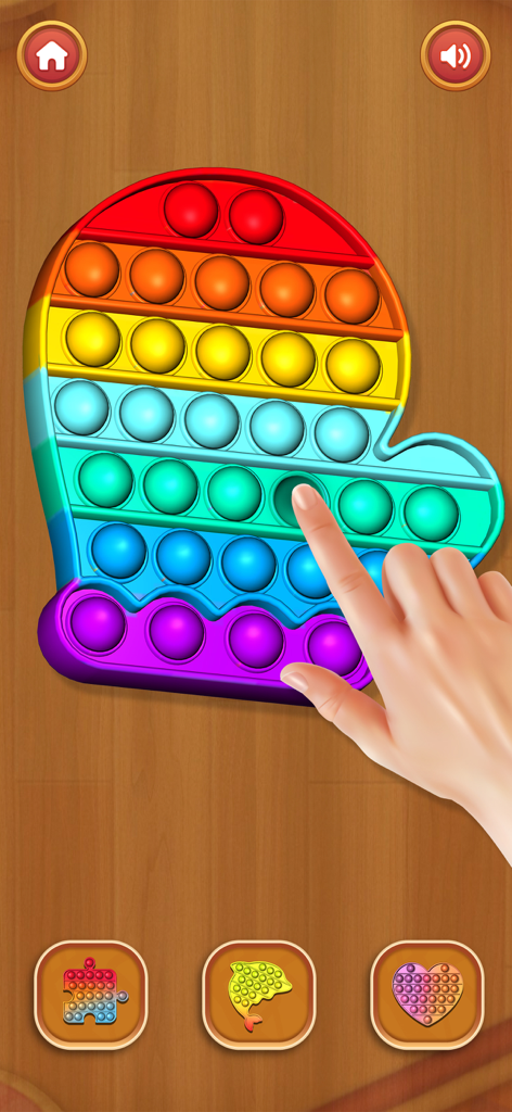 Mini Relaxing Game: Antistress - Hand pressing bubbles on a rainbow mitten shaped Pop It toy in an antistress game
