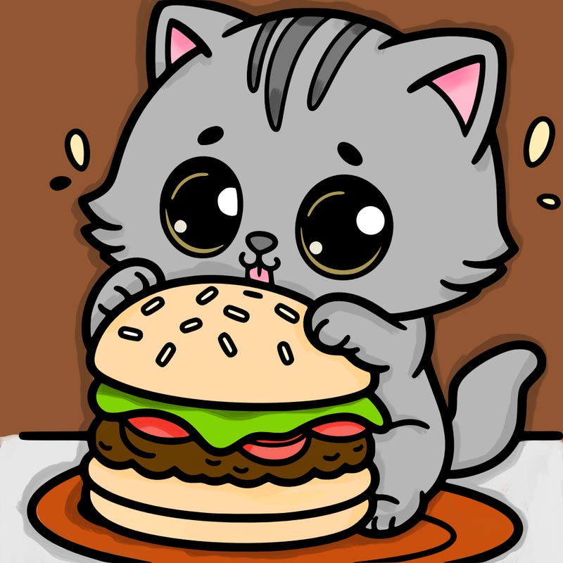 kitten eating a hamburger