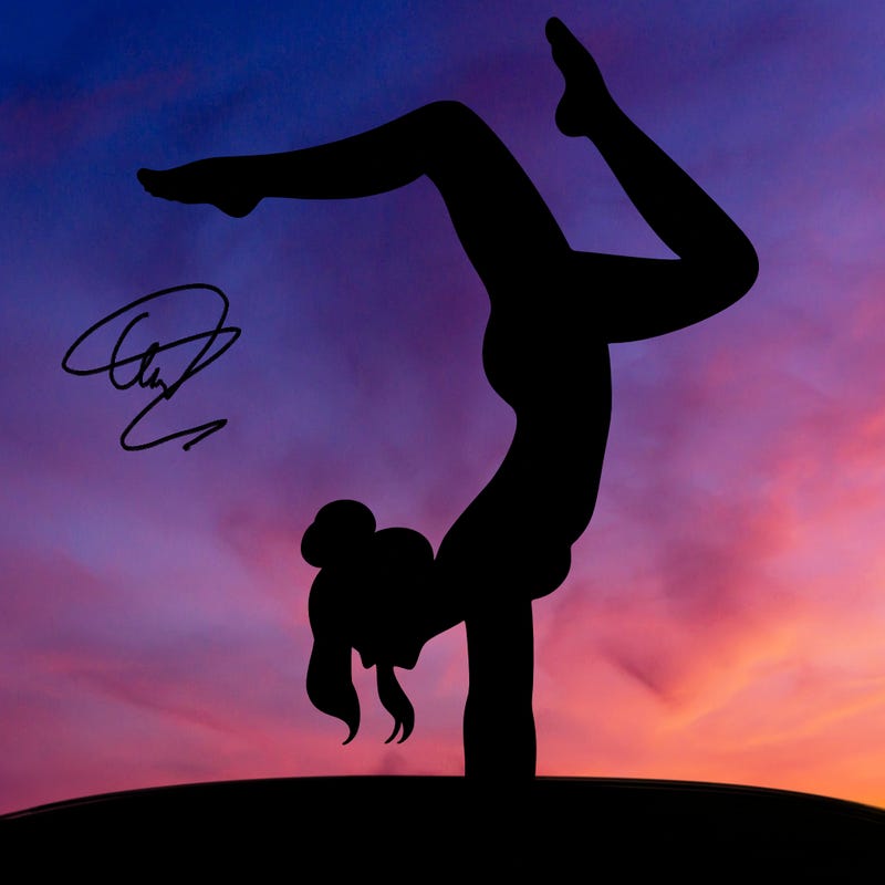 a woman doing a handstand