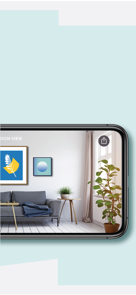 Smartphone mostrando vista de realidad aumentada de cuadros en una pared en una sala de estar moderna