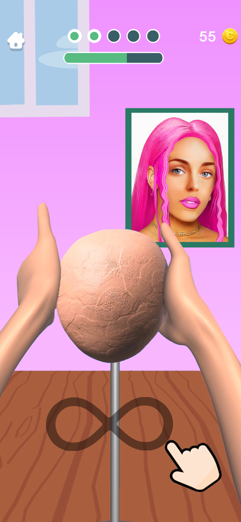 Hands shaping a clay head in the Sculpt People mobile simulation game