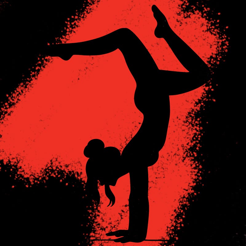 a woman doing a handstand