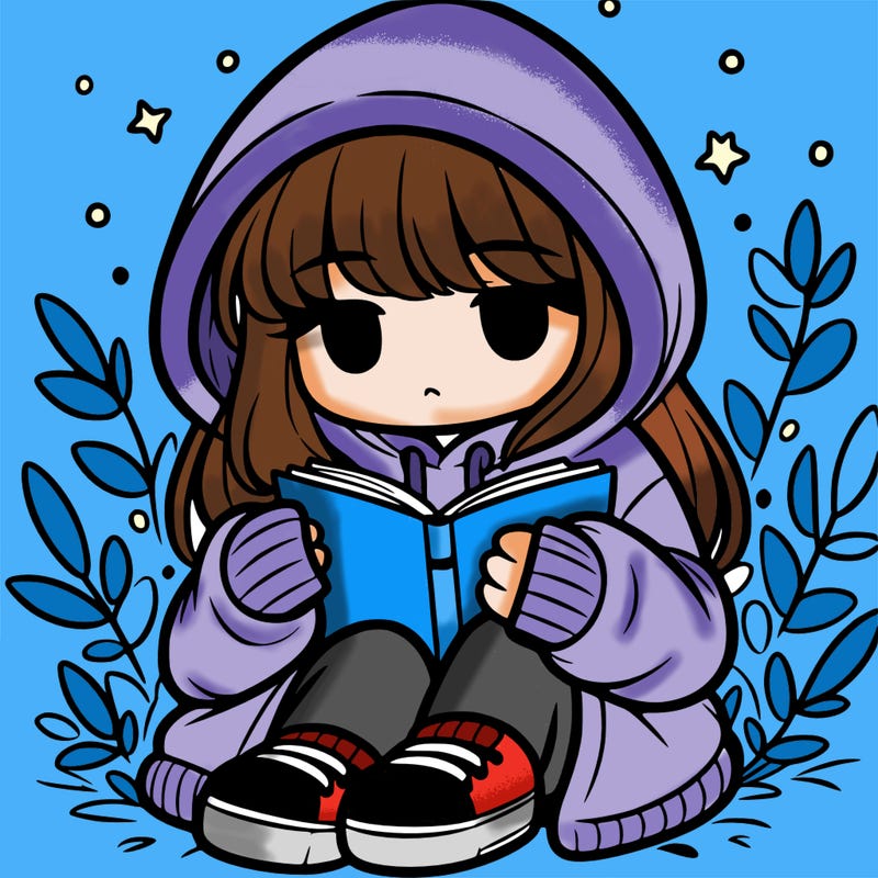 girl in oversized hoodie reading a book
