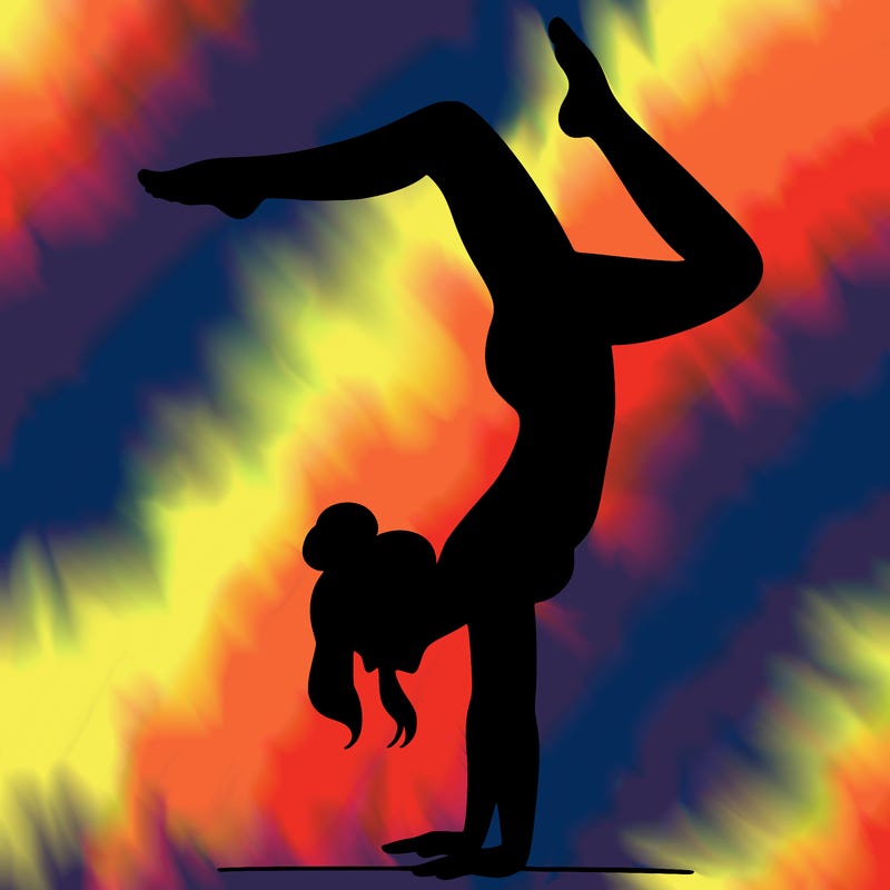 a woman doing a handstand