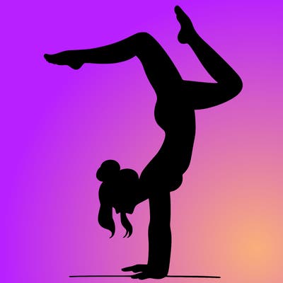a woman doing a handstand