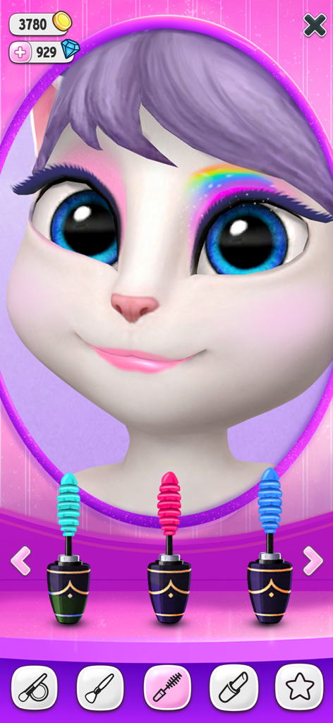 Talking Angela wearing rainbow eyeshadow and choosing between colorful mascaras.