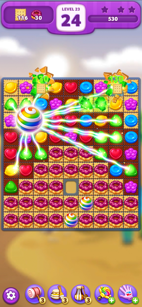 Lollipop: Sweet Taste Match3 - Gameplay screenshot of Lollipop Sweet Taste Match3 featuring a rainbow booster clearing colorful candies and donuts