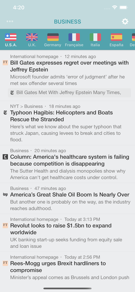 La aplicación NewsFlash muestra un feed de noticias de negocios con banderas de países internacionales para seleccionar