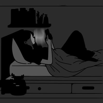 a girl laying on her bed with her phone