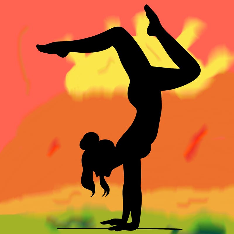 a woman doing a handstand