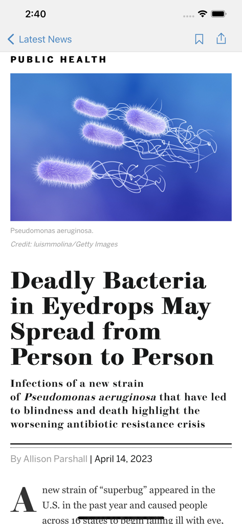 Scientific American app interface displaying a public health article about deadly bacteria in eyedrops with an illustration of Pseudomonas aeruginosa.
